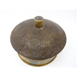  Early 19th century toleware spice box in the form of a thatched cottage, painted with doors, trellis windows, flowers and trees, textured thatched roof cover and turned wooden handle enclosing a central nutmeg grater and segmented compartments, D19cm   