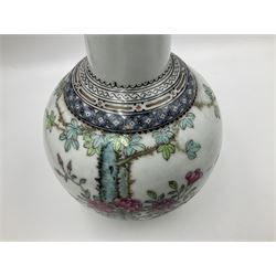 Pair of Chinese Republic porcelain vases, each painted in Famille Rose enamels with pairs of pigeons amidst peony, rock, flowering plants and leafy branches, possibly Qianlong seal beneath, H22cm 