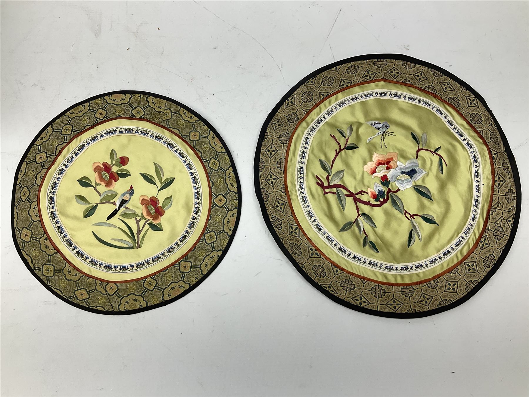 Six Chinese silks on fabric panels embroidered with birds on blossoming branches, along with three other Chinese painted silks 