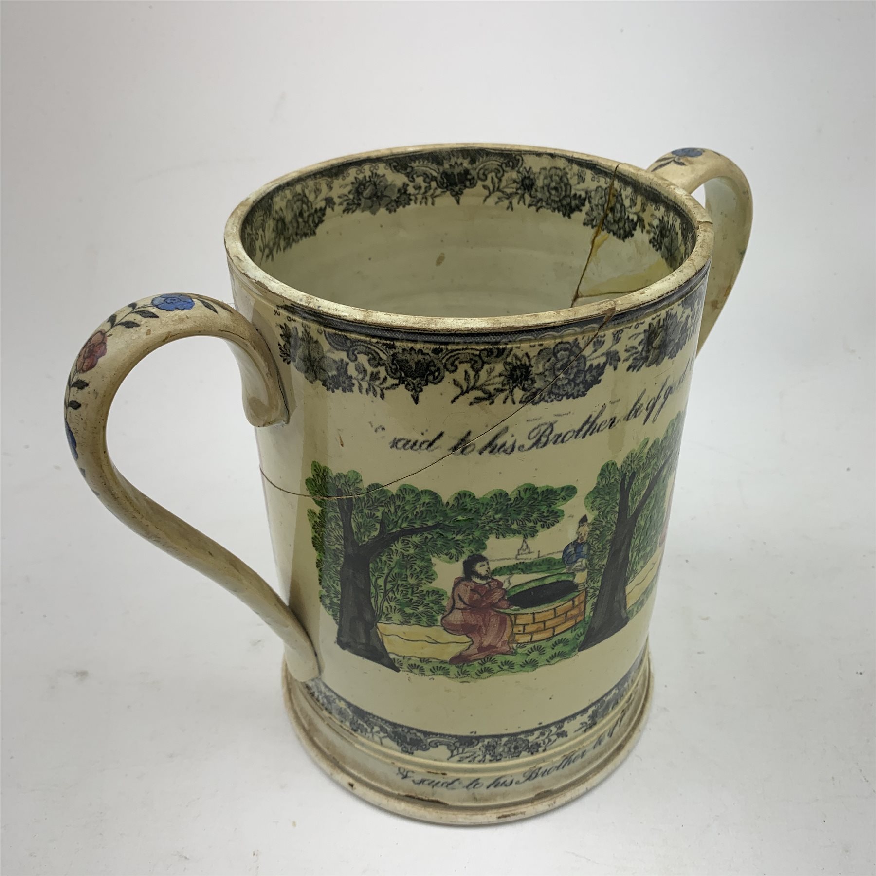 A large 19th century Staffordshire loving cup, detailed 'The Real Cabinet of Friendship Justice and Equity' (a/f), H22cm, together with a pair of 19th century Staffordshire dalmatians, upon oval blue bases, H13cm, a Dresden ewer hand painted with floral sprays, with mark beneath, H15.5cm, and a Coalbrookdale style floral encrusted vase and cover, H16.5cm. 