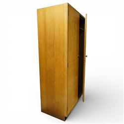 Mid 20th century oak veneered wardrobe, the plain rectangular top above a pair of hinged doors fitted with circular handles, opening to reveal a hanging rail and upper shelf, one door with inset mirror, the whole raised on a plinth base