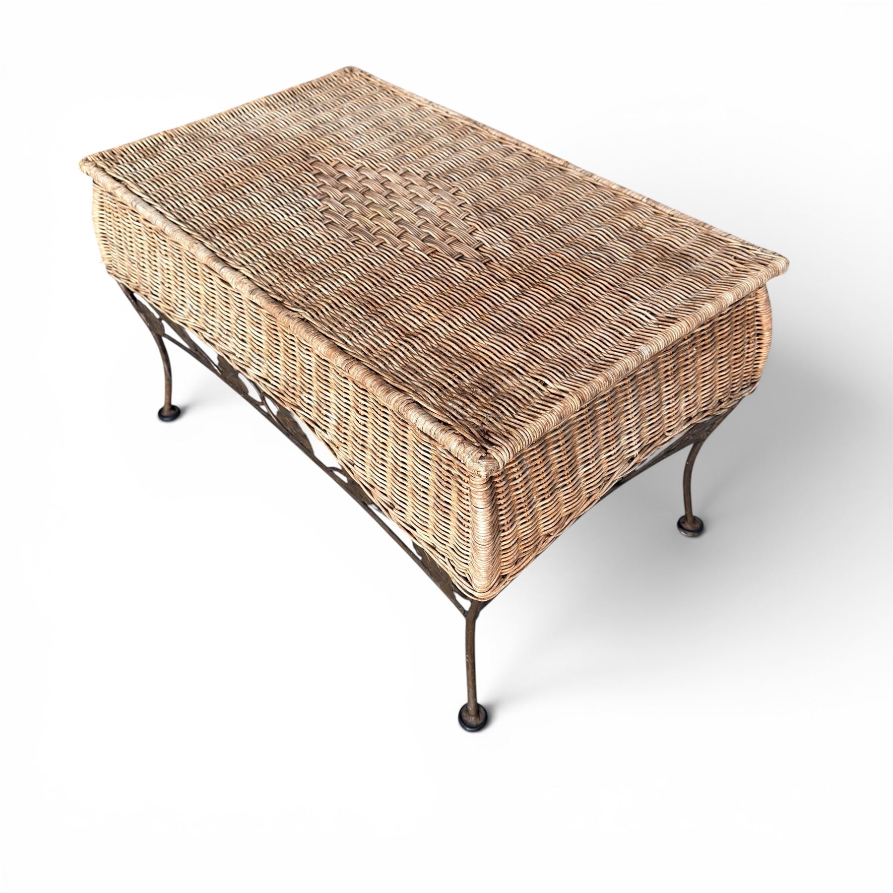 Basket work coffee table featuring scrolling leaf edging on tapered lags