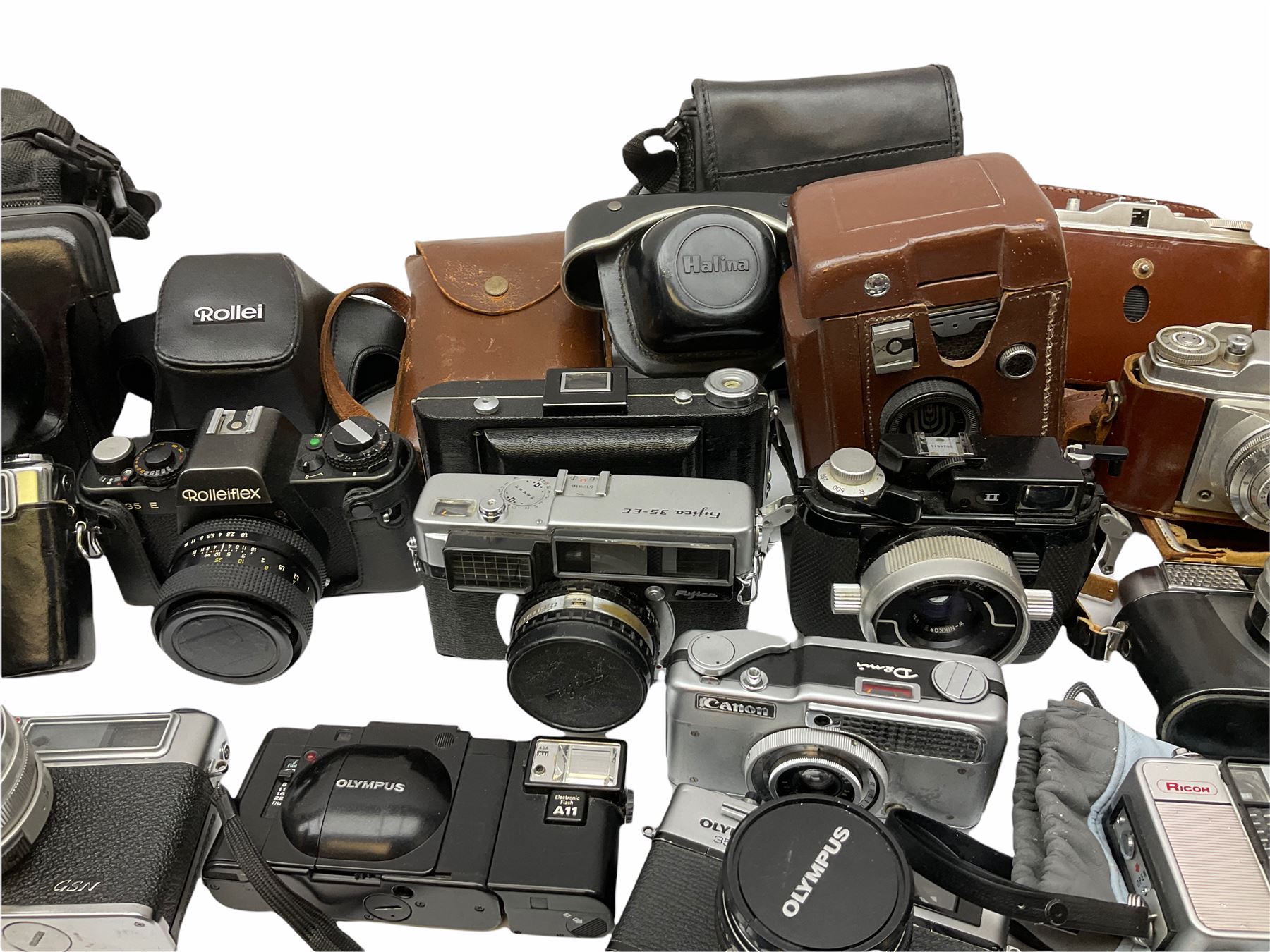 Collection of cameras, to include three Olympus Trip 35,  Balda Super Baldax, Seagull 4A TLR Camera, Pentax MG, Pentax-MV1, Yashica, two Yashica Electro 35, Rollei B35, Fujica 35 EE etc. 