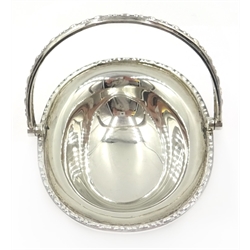  Silver bon-bon basket with swing handle and four feet by Sibray, Hall & Co Ltd Sheffield 1919, length 10cm and a bow handled basket by Synyer & Beddoes Birmingham 1912 length 15cm approx 5oz  