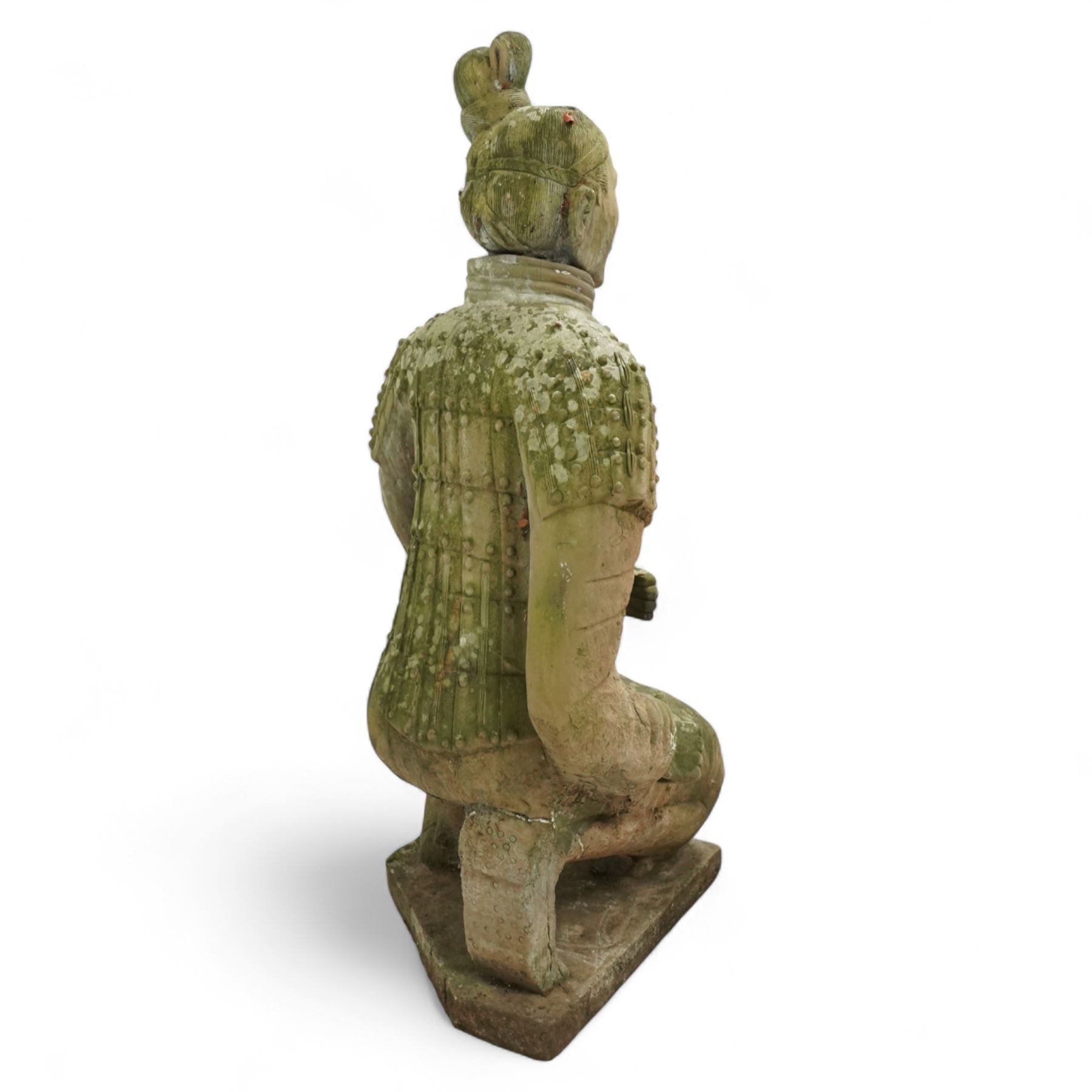 Two near life-size terracotta warrior figures, modelled in the style of the Qin dynasty soldiers, each kneeling with one arm raised, wearing detailed armour and tunics, one example partially damaged and lacking sections