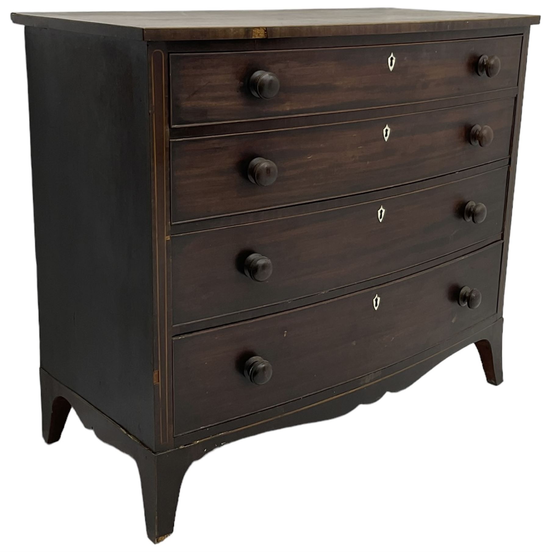 George III mahogany bow-front chest, crossbanded top with satinwood stringing, fitted with four graduating cock-beaded drawers, each with bone shield shaped escutcheons and turned handles, shaped apron flanked by splayed feet