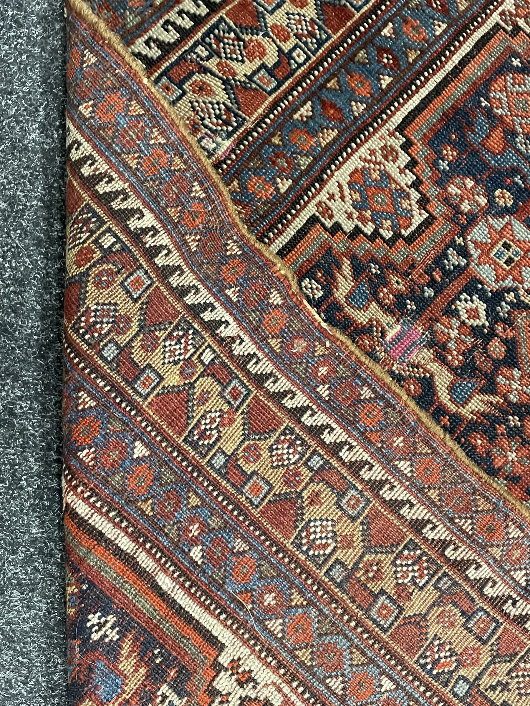 Persian rug, blue ground field decorated with quadruple pole medallion