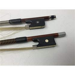 Two student half-size cellos - Boosey & Hawkes Artia with 65cm one-piece back and spruce top; bears maker's label; L104cm overall; and Romanian with 65.5cm two-piece maple back and ribs and spruce top; bears label; L108.5cm overall; each in soft carrying case with two bows (2)