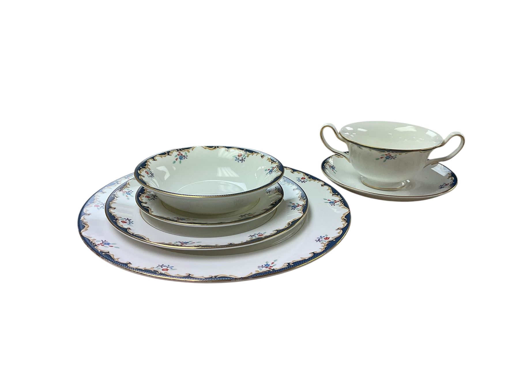  Wedgwood Chartley pattern dinner service for six, including dinner plates, dessert plates, six twin handled soup bowls etc, together with a near matching teapot