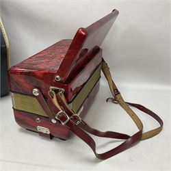 German Hohner student II compact accordion with 26 keys and 12 bass registers in a hard case With tutor