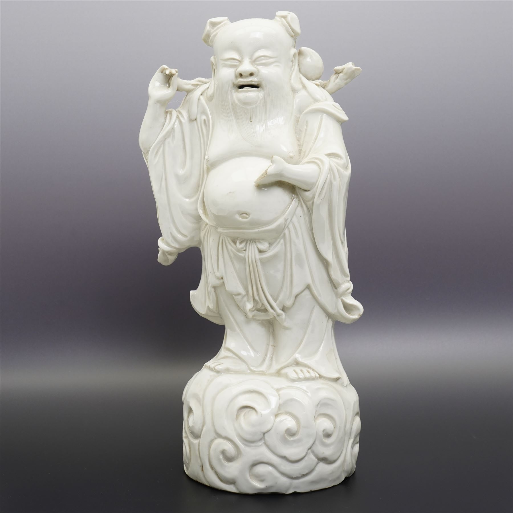 Chinese blanc de chine figure of Shou Lao, standing upon a cloud, H36cm 