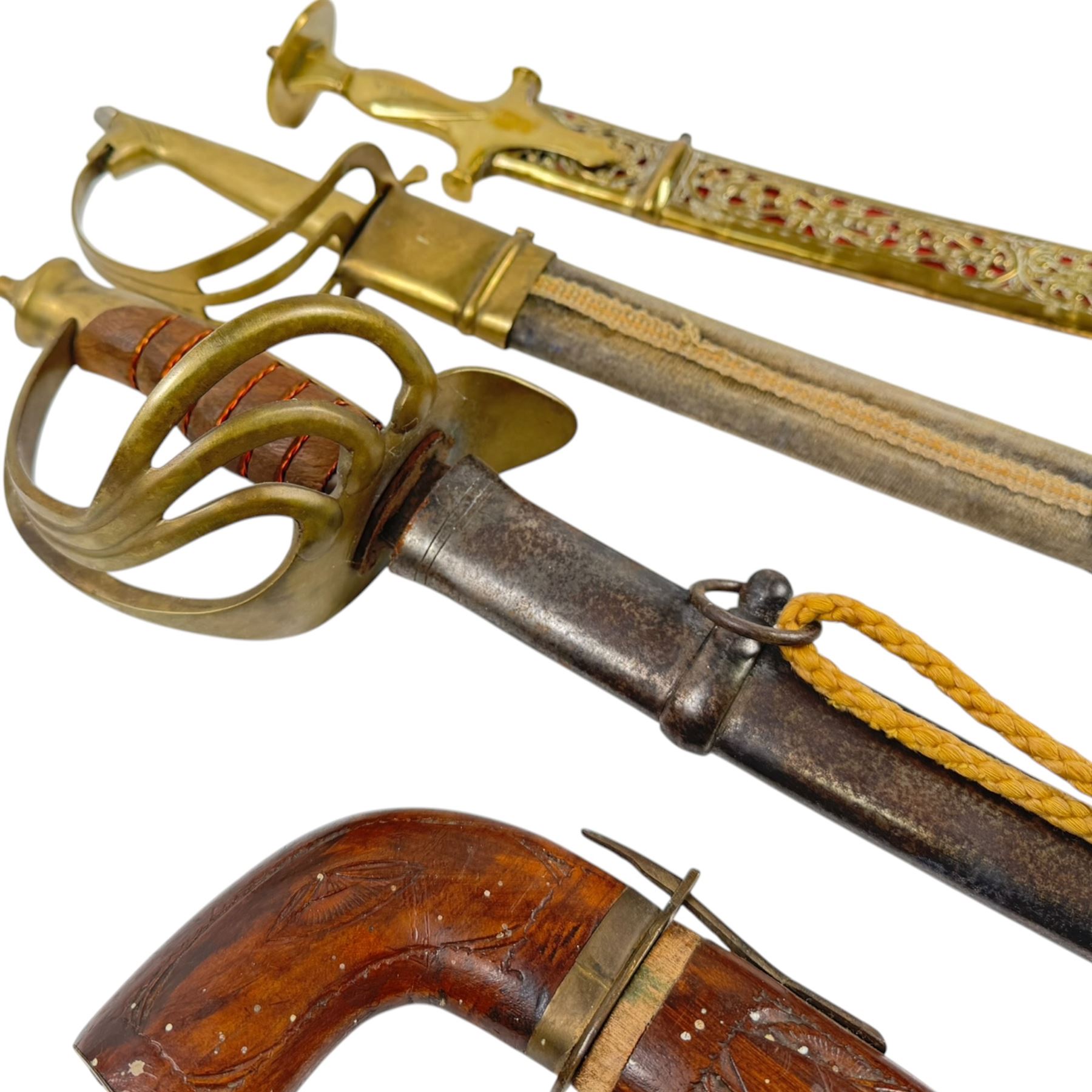 Three Indian swords, including Ceremonial Tulwar style sword with pierced decoration to brass scabbard, etc 