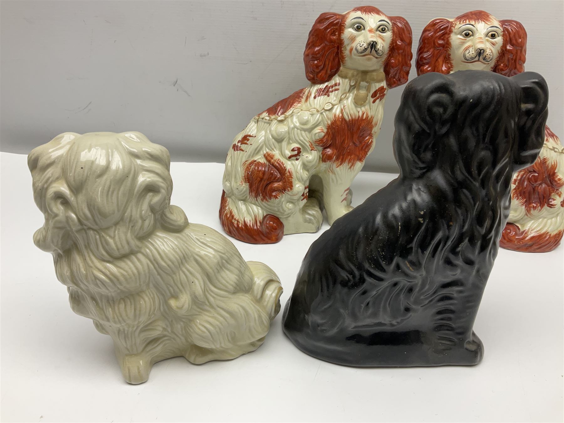 Two Pairs of Staffordshire style dogs, together with three other examples, largest example H27cm