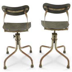 Pair of mid 20th century 'Tan-Sad' industrial chairs, black moulded fibre seats, raised on four supports