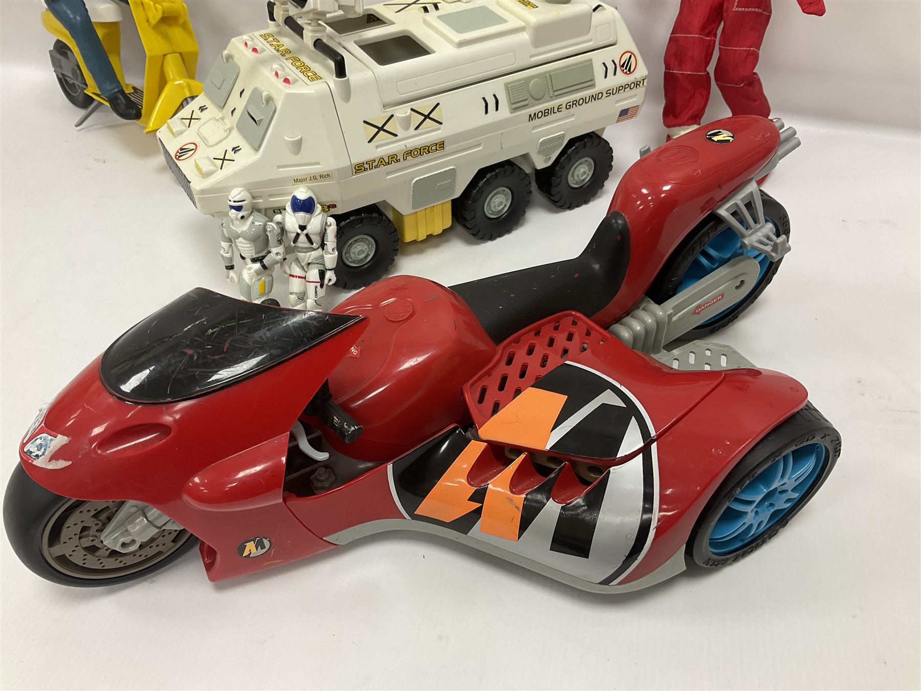Manta Force Red Venom 1987 Bluebird Toys PLC toy plane with associated figures, with three more toy vehicles and figures comprising Lanard 1996 S.T.A.R Force Mobile Ground Support truck, Hasbro 2000 Action Man motorbike with side car, Sindy moped 