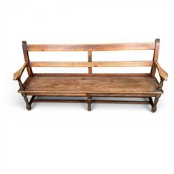 Early 20th century pine and oak bench seat, stained pine rail back frame with shaped oak arms