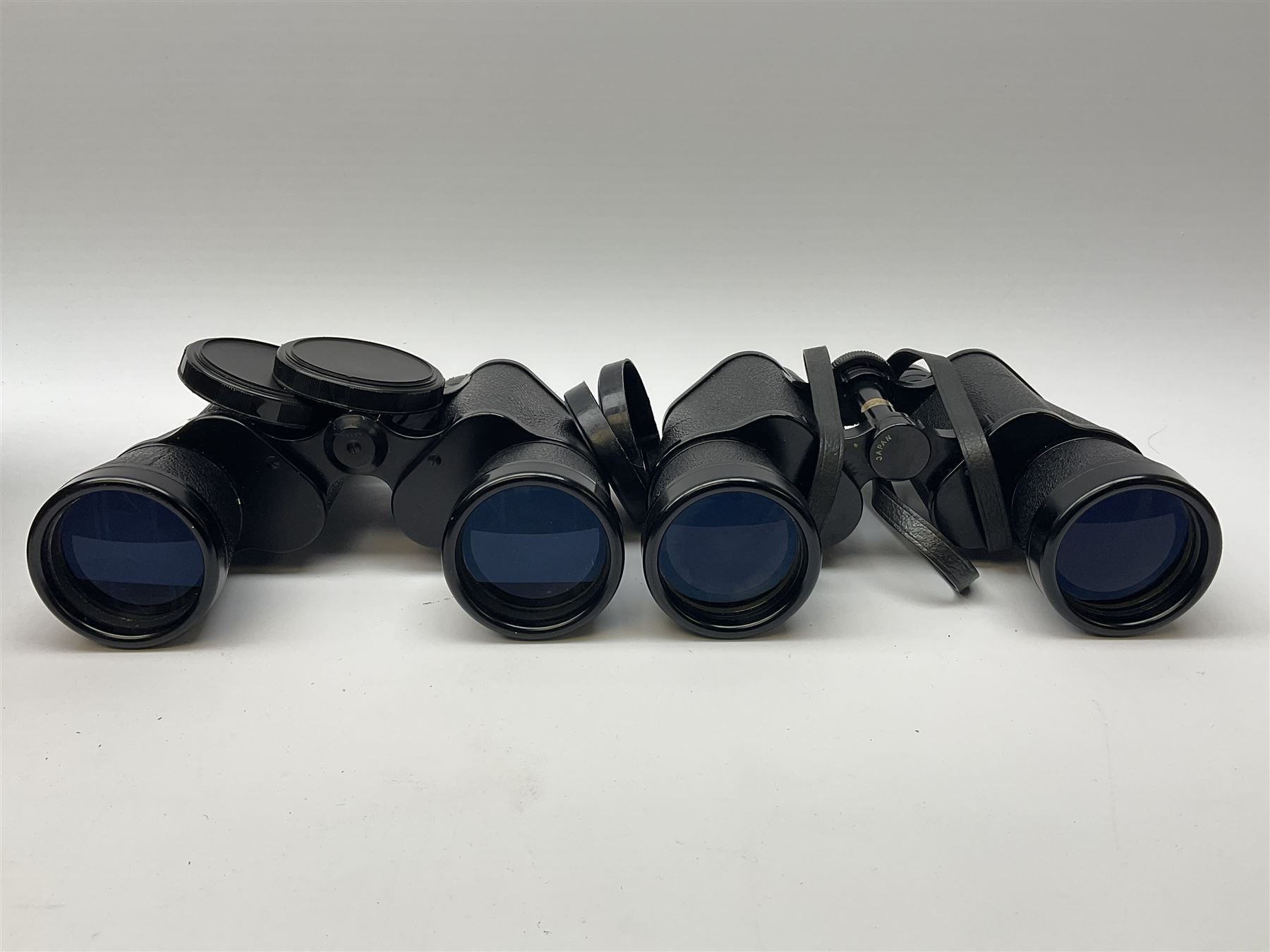 Two pairs of binoculars, Stellar binoculars in case and Tasco binoculars model 306 in case. 