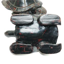 Set of four Asian carved and lacquered graduated ornamental turtles, largest L30cm