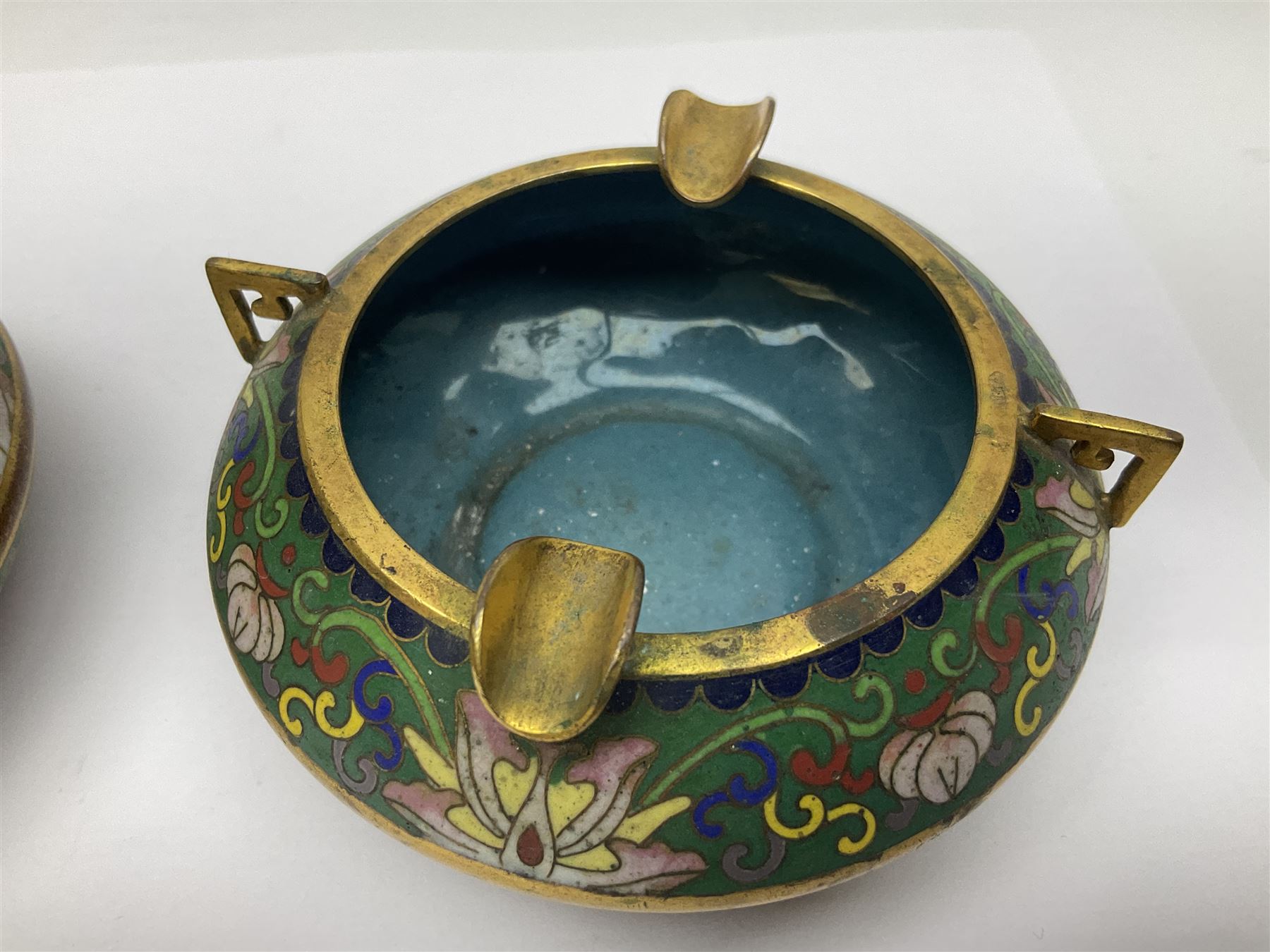 20th century Chinese cloisonne enamel smoking set, comprising two ashtrays, box and tray, with floral and foliate scrolling on green ground