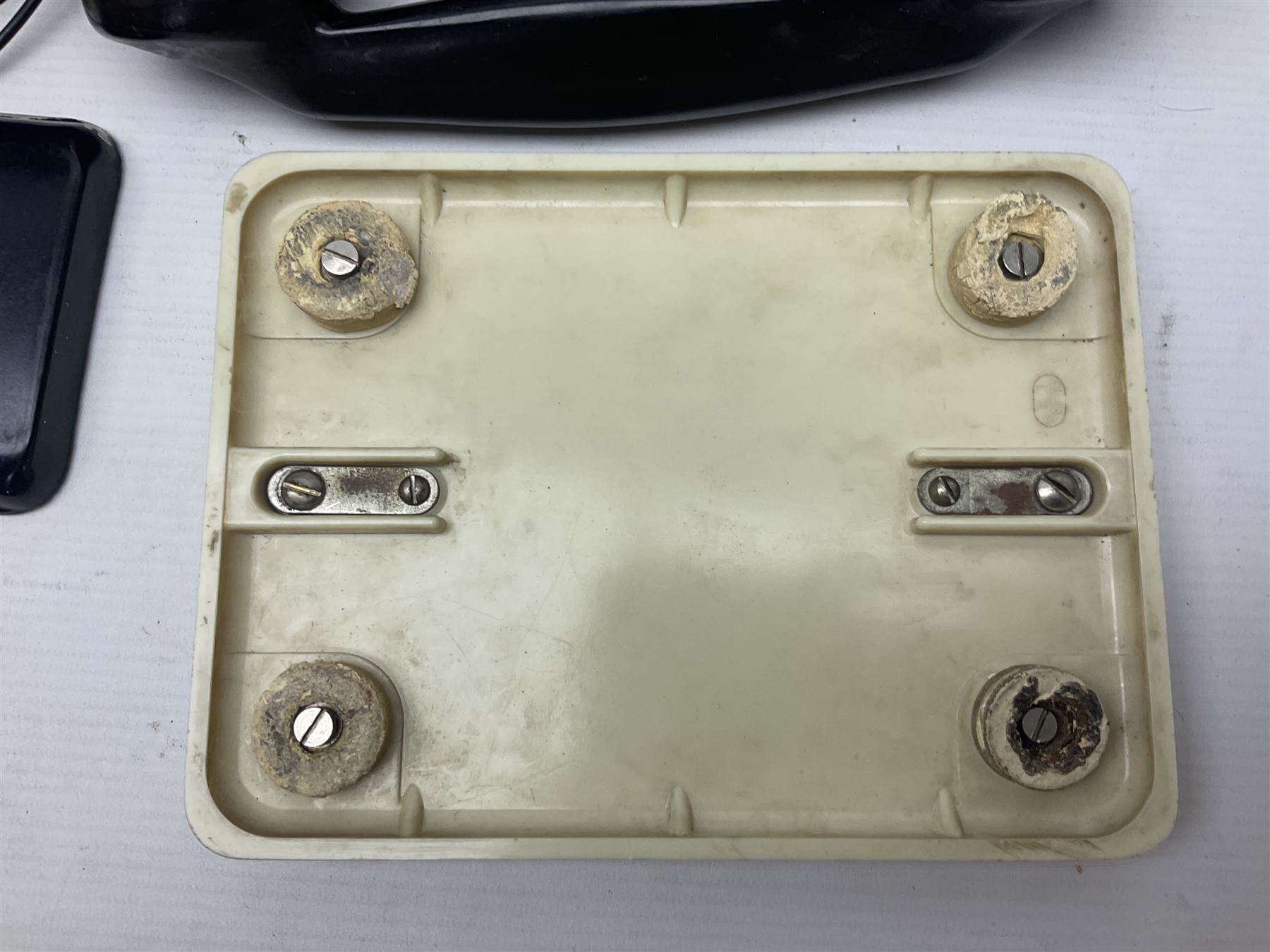 Collection of phone headsets, including GPO bakelite examples, together with other telephone parts 