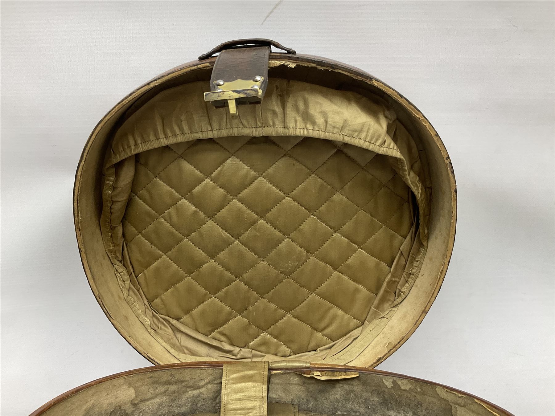 Early 20th century black silk top hat by Woodrow of Manchester and London, with manufacturer's stamp to the silk lined interior, housed in fitted tan leather hat box with removable internal compartments with straps, brass escutcheon and engraved plaque, hat internal measurements approx 20cm x 15cm