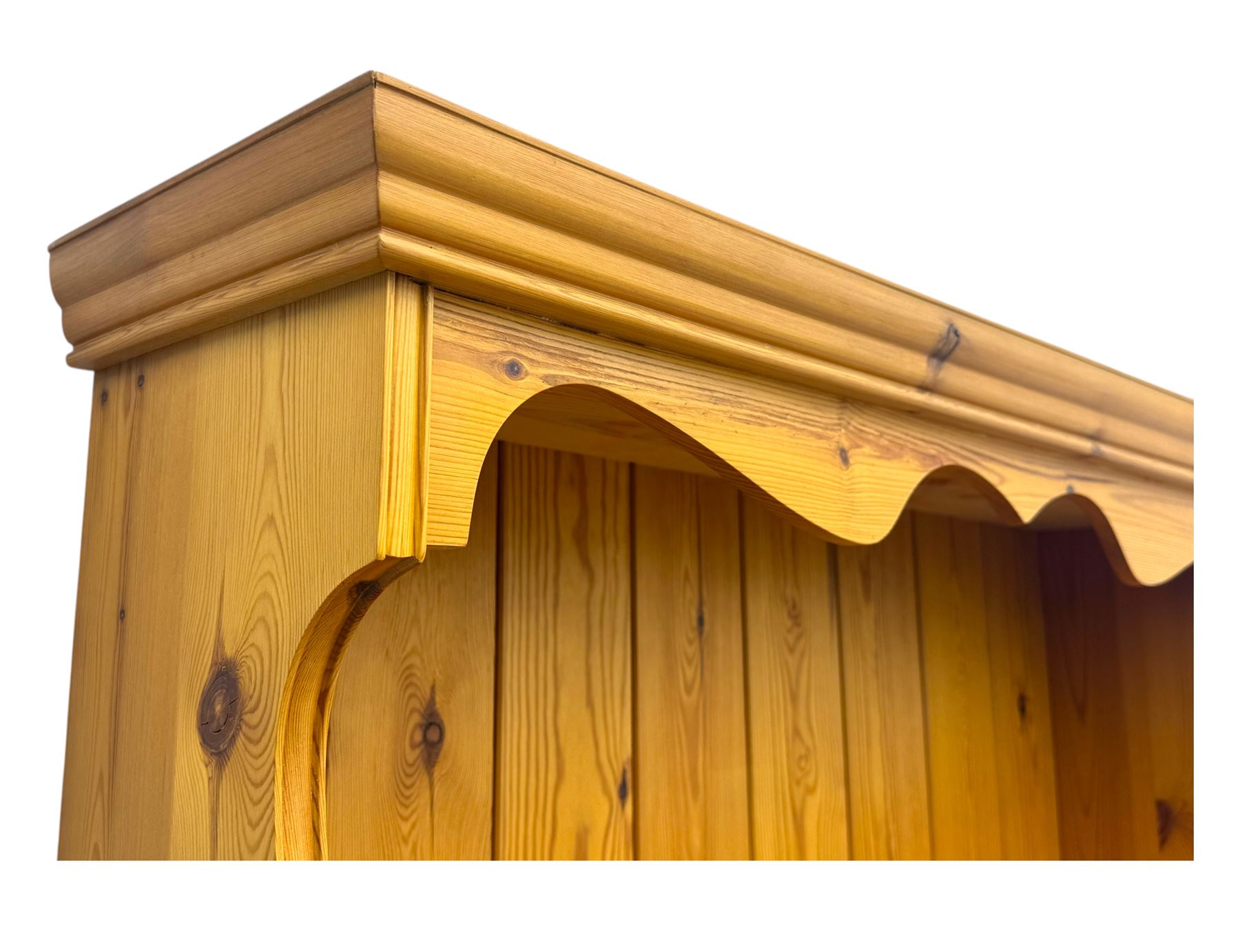 Victorian design pine dresser, projecting moulded cornice over scalloped frieze and two open shelves, base fitted with two drawers over double cupboard, on shaped plinth base