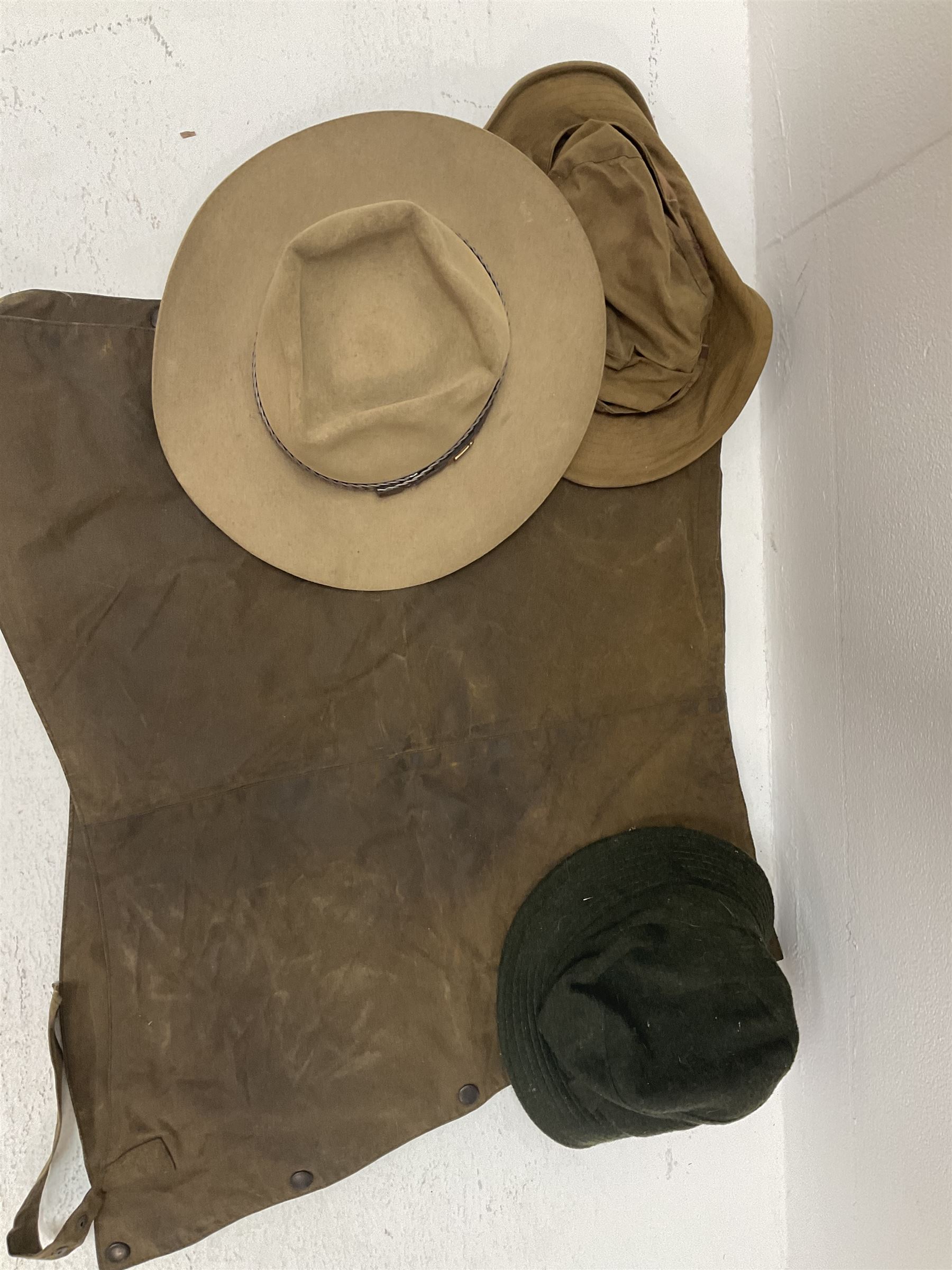 A ladies Barbour quilted dark green jacket, size 14, together with a further Barbour green quilted jacket, no size label, two Barbour 'pile lining' gilets/jacket inserts, two Barbour hats, three Akubra 'pure fur felt' hats, etc. 