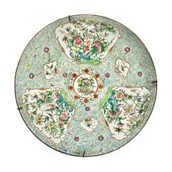 Late 19th/early 20th century Chinese Famille Rose charger, decorated in polychrome enamels with panels of birds amongst peonies, upon a celadon ground, D34.5cm