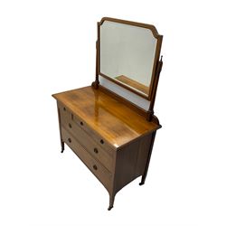 Early 20th century walnut dressing chest, swing mirror back, fitted with three small drawers above two long drawers, on brass and ceramic castors