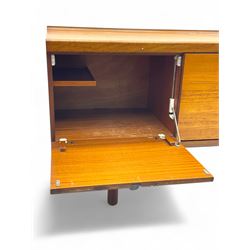 White & Newton - mid-20th century teak sideboard, rectangular top with raised back over fall-front storage compartment, double cupboard and three drawers, raised on cylindrical supports