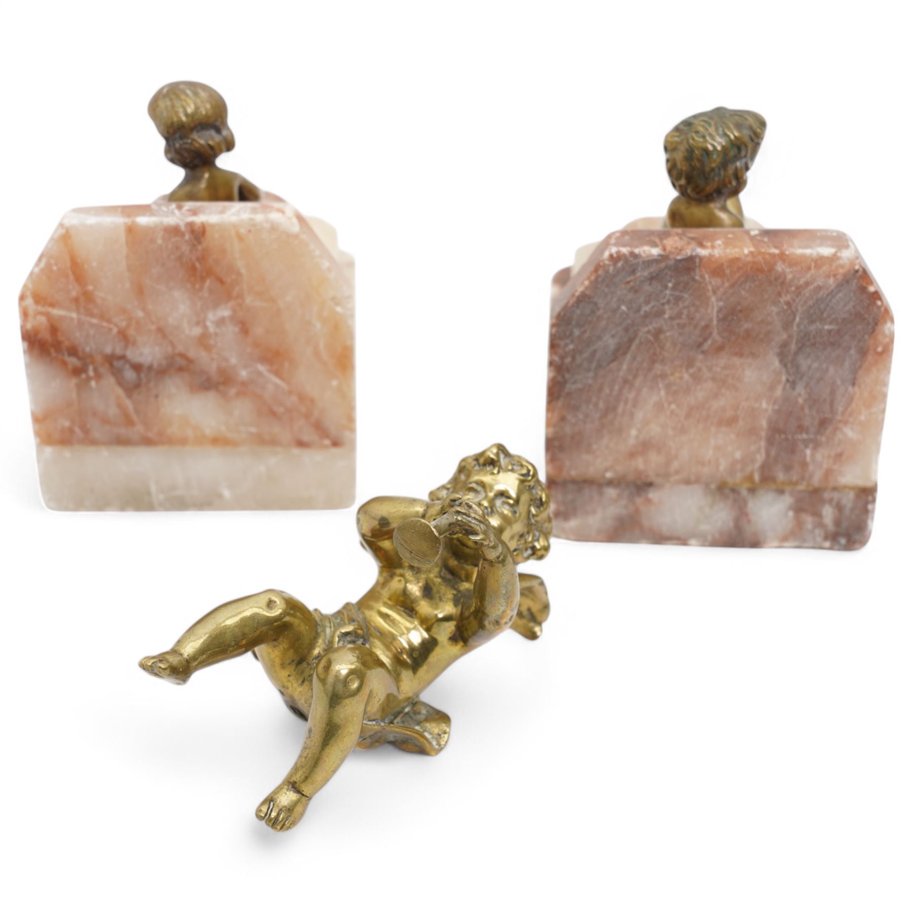 Brass and marble bookends with reclining putti figures, together with a brass figure of a cherub, bookends H8cm 