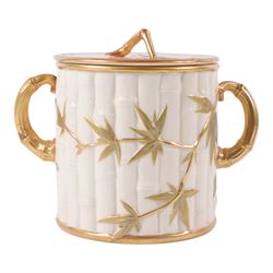 Royal Worcester Blush Ivory twin handled biscuit barrel and lid, in the form of bamboo wit...