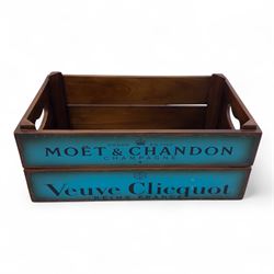 Three-piece champagne advertising display set, comprising pine steps with painted Dom Pérignon and Bollinger lettering, and two wooden boxes branded Moët & Chandon and Veuve Clicquot (Steps H 80cm, W 44cm, D 68cm, crates each H 18cm, W 44cm, D 26cm)