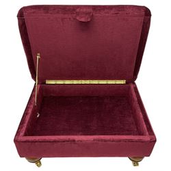 Duresta - traditional shape armchair upholstered in burgundy red velvet, on square tapering front supports (W88cm, H85cm, D103cm); together with a matching rectangular footstool with hinged seat, on turned feet with brass castors (73cm x 54cm, H38cm)