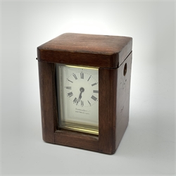 A brass cased carriage clock, the white enamel dial with black Roman numerals, marked Pearch & Sons Leeds, York & Leicester, including handle H14cm, in fitted case. 