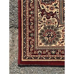 Royal Kashmir worsted wool modern Persian design area rug, with crimson field and stylised rosette patterning throughout, surrounded by wide multi-band border incorporating cartouche and lotus flower motifs
