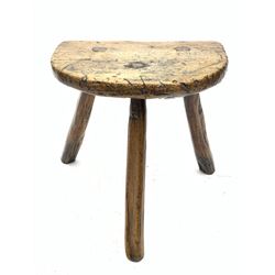 18th century elm three legged stool,  D-shaped top with three splayed supports, visible wedged joints 