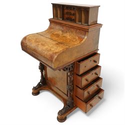 Victorian figured walnut piano top Davenport desk, hidden compartment lifting to reveal small drawers and pigeonholes, the piano lid enclosing drawers and sliding top with hinged leather writing surface, the right-hand side fitted with four drawers, on compressed bun feet 