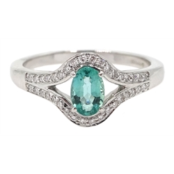 18ct white gold oval emerald and diamond ring, hallmarked, emerald approx 0.50 carat