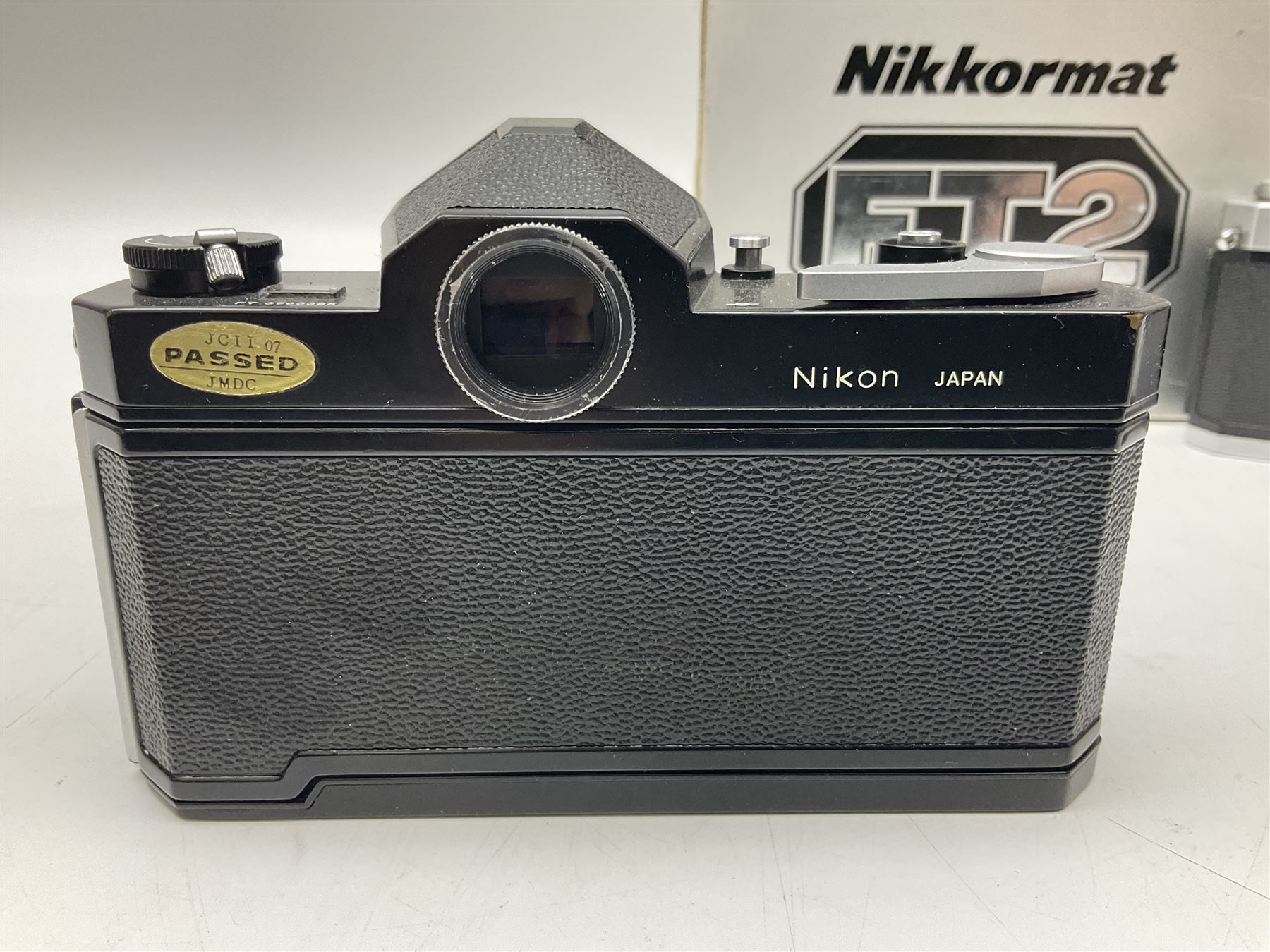 Nikkormat FT2 camera body, serial no. 5066813, in original packaging, together with Nikkormat EL camera body, serial no. 5577358, with Nikon Nikkor 50mm 1:1.8' lens no. 2143575, Nikkormat FT, serial no. 3968385, and Nikomat FT camera body, serial no. 4015491