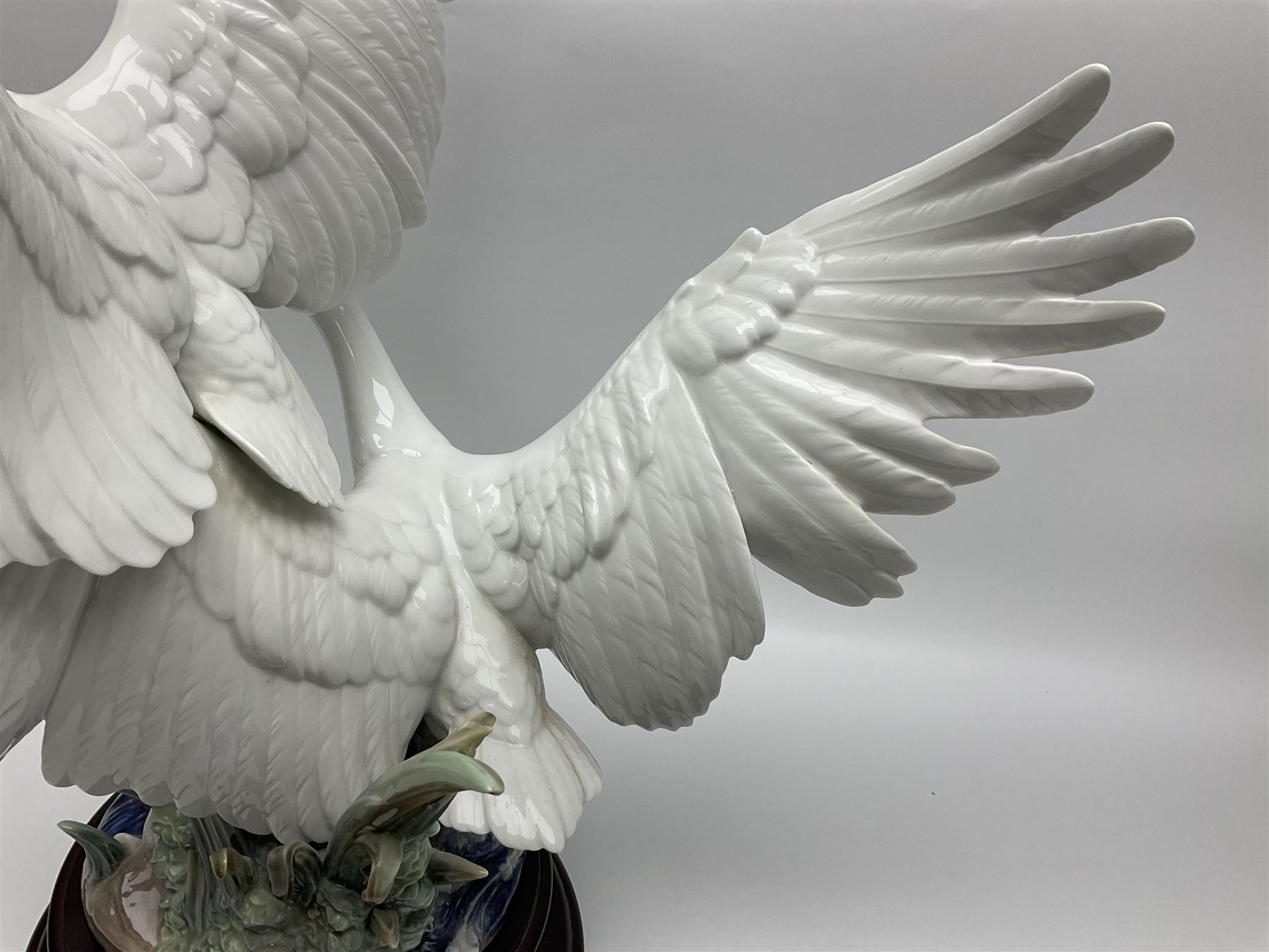 Large Lladro figure group, Swans Take Flight, modelled as two swans upon raised on circular wooden plinth, sculpted by Salvador Debon, H68cm