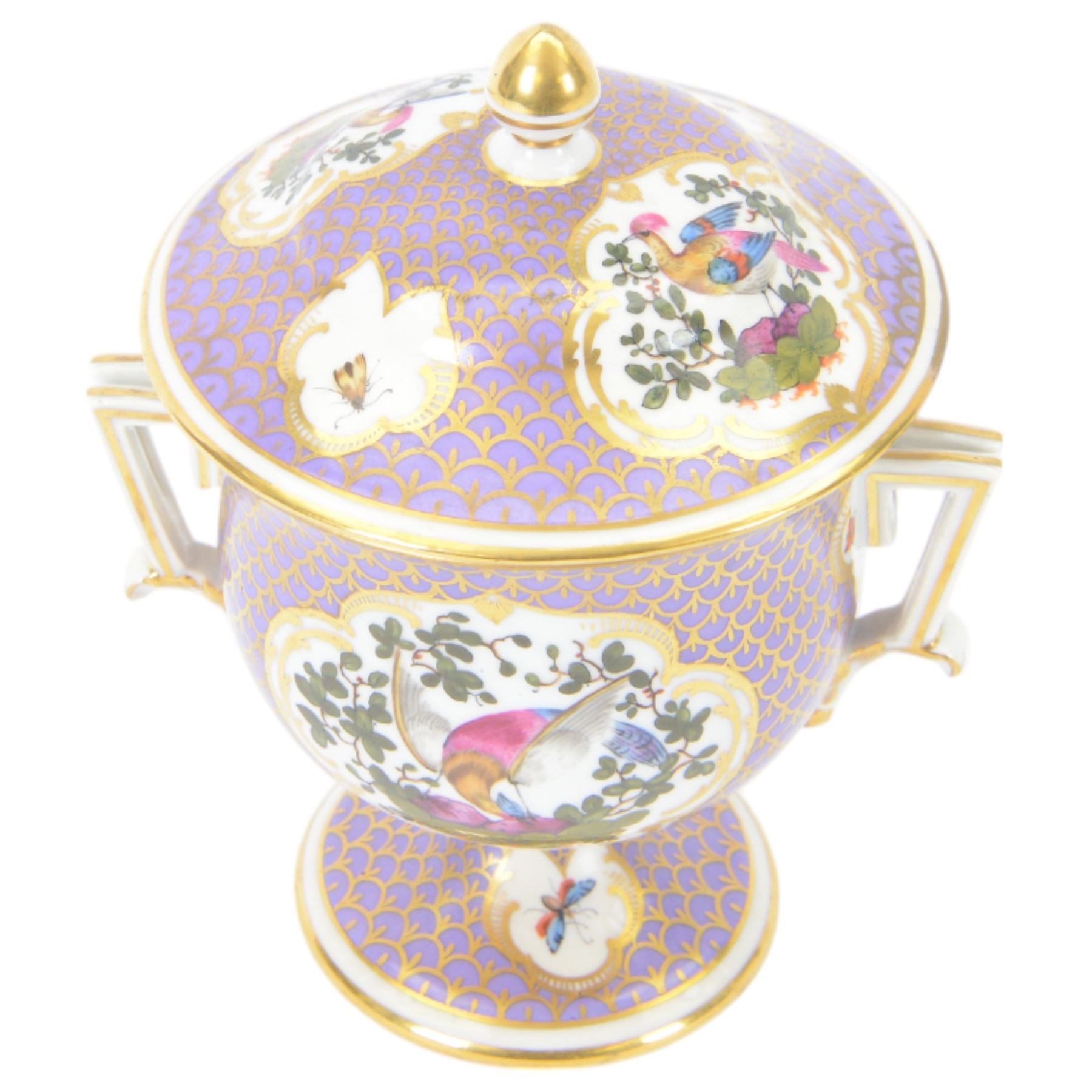19th century twin handled cup and cover, the pedestal cup decorated with panels of exotic plumed birds in the manner of Giles, against a purple and gilt scale ground, the cover similarly decorated, H19cm