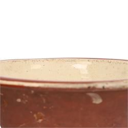 19th century pancheon, of tapering circular form, the glazed interior with slip decoration H20cm, D42cm 