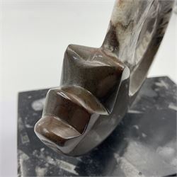 Goninite sculpture, poslised goninite, mounted upon a rectangular marble base with with orthoceras and goniatite inclusions, age: Devonian period, location: Morocco, H18cm