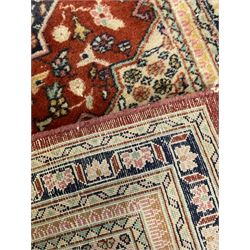 Persian red and blue ground prayer rug, decorated with stylised plant motifs (106cm x 70cm); Persian red ground rug, the field decorated with geometric medallions surrounded by small stylised motifs (98cm x 61cm