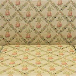 Louis XV design giltwood framed settee, the frame with applied foliate detail,  three loose seat cushions, upholstered in pineapple patterned fabric