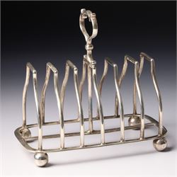 Edwardian silver six division toast rack with loop handle and ball feet Sheffield 1908 Mak...