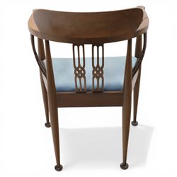 Early 20th century Hepplewhite style mahogany armchair, upholstered shaped back over pierced splat back with linked oval decoration, open arms and upholstered seat, on square tapering supports terminating in pad feet