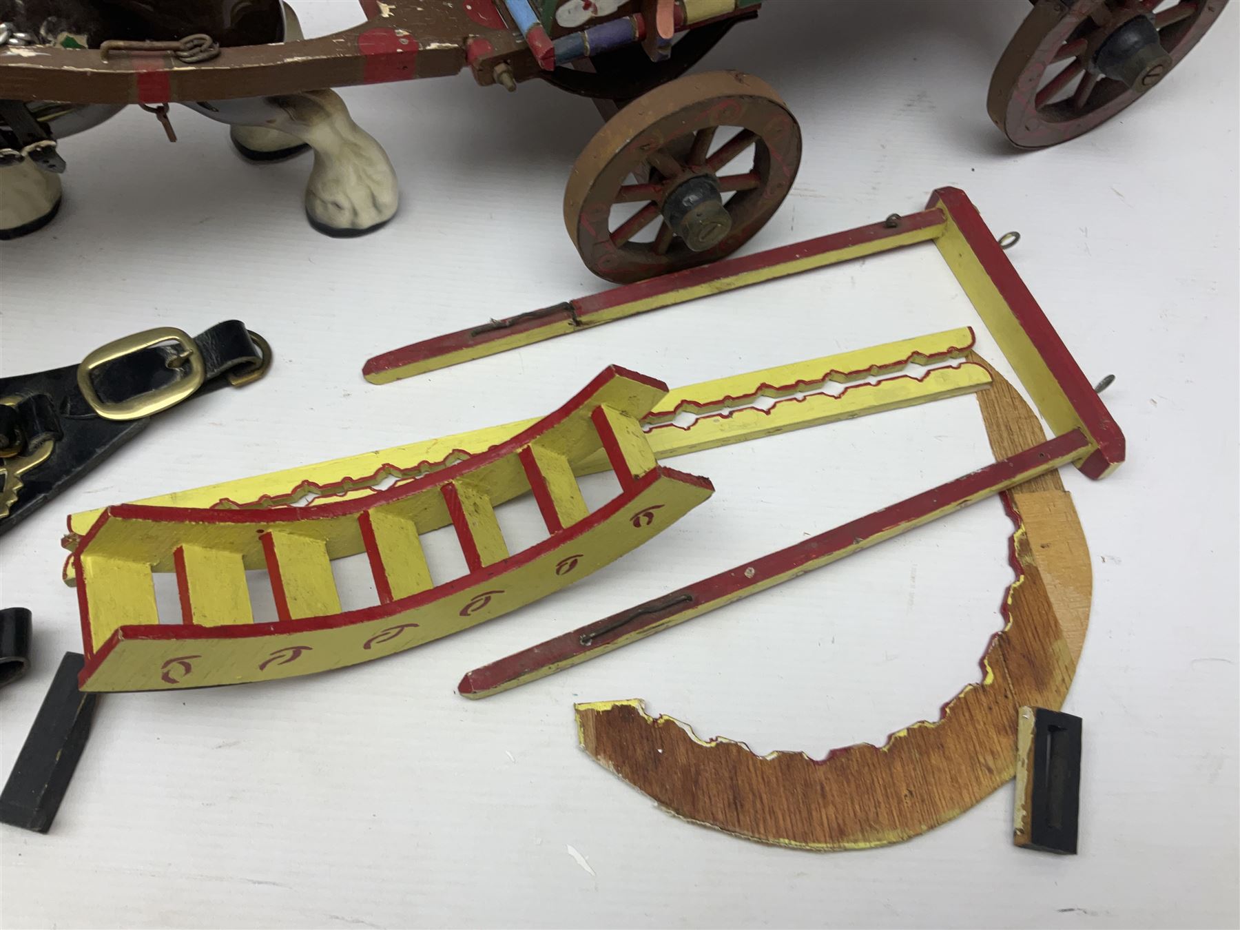 Two ceramic shire horse and gypsy caravans, together with horse brasses 