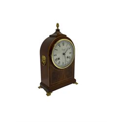 Comitti of London - 20th century 8-day mantle clock, in classic round topped mahogany case with inlaid stringing to the front and lion mask handles to the sides, raised on a narrow plinth with bracket feet, twin train going barrel movement with a floating balance escapement, striking the hours and half hours on a bell.    